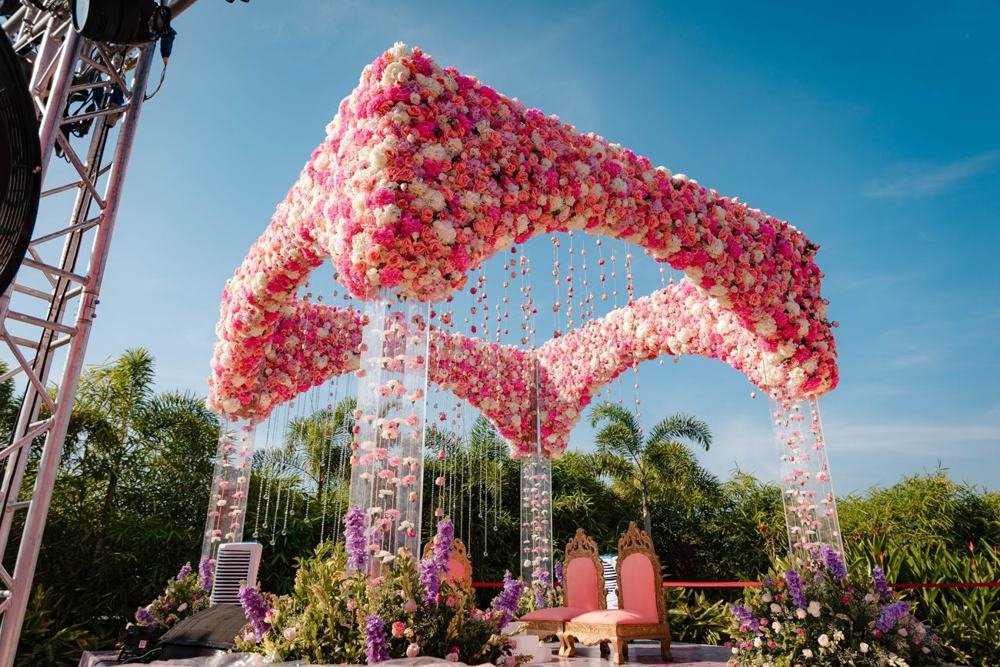 Pink floral mandap against the sky