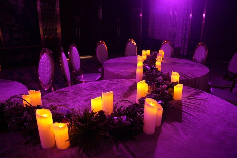 Candlelit lounge in violet light