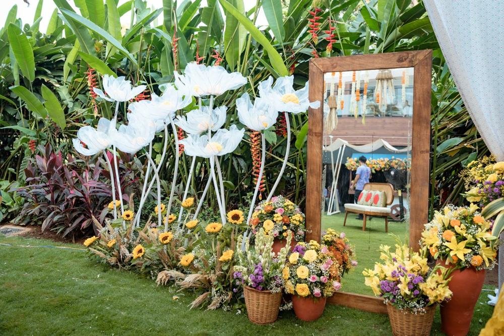 Garden mirror with white floral installation