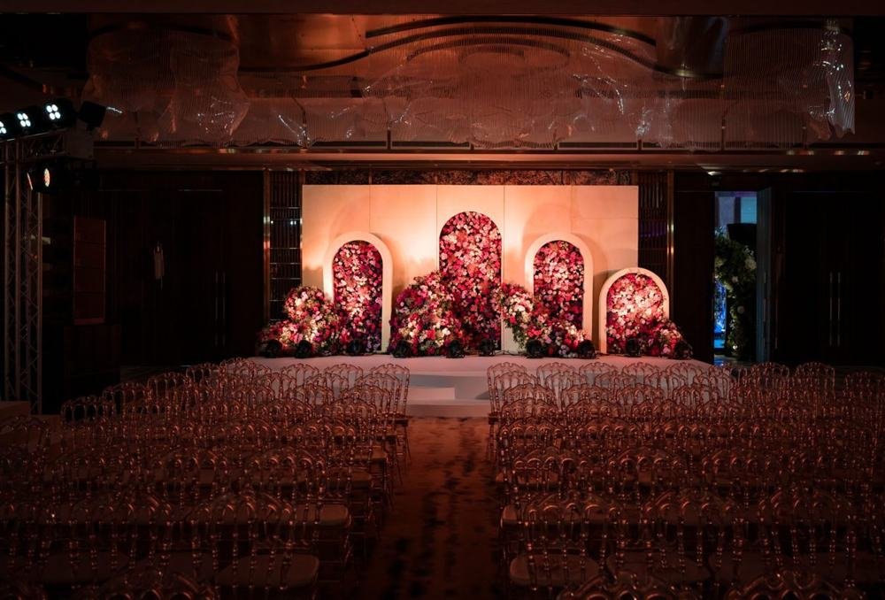 Floral arch stage in a grand ballroom