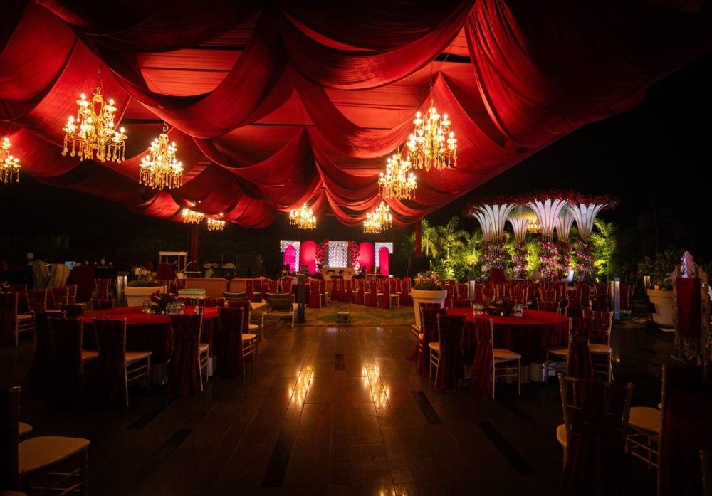 Crimson draped ceiling with chandeliers